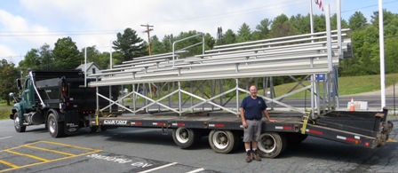 bleachers on a low bed and a volunteer