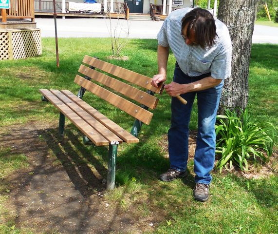 man installing bench