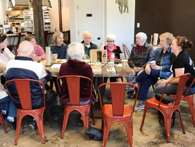 group of people around a resturant table