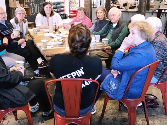 group of people around a resturant table