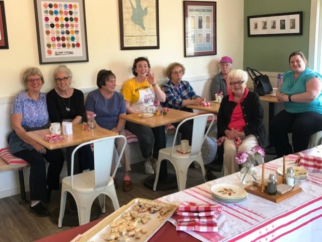 group of people around a resturant table