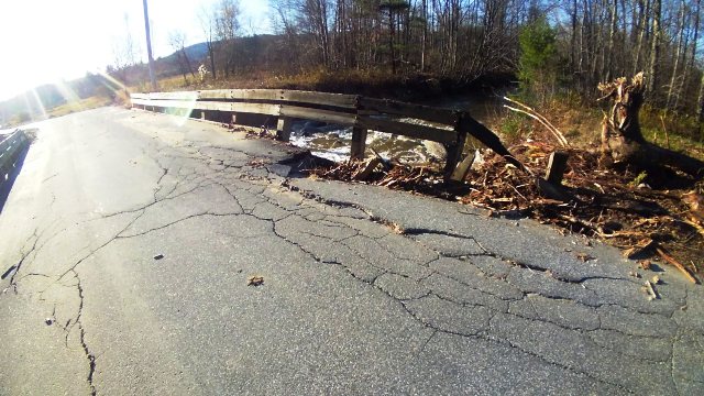 road washing away near bridge