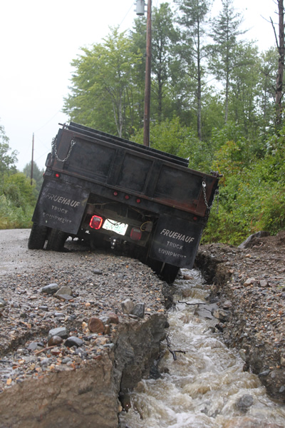 truck in ditch created by hurricane