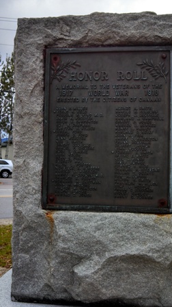 memorial stone set with bronze plaques of veteran names