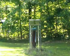 Wellhead pipes extending from ground.