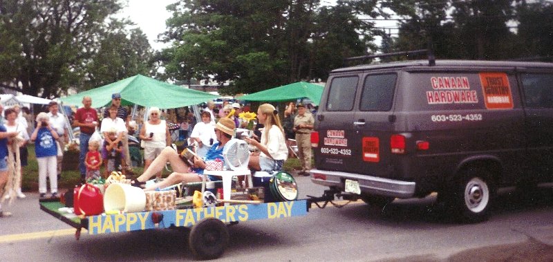 parade float of man being pampered on a lawn chair