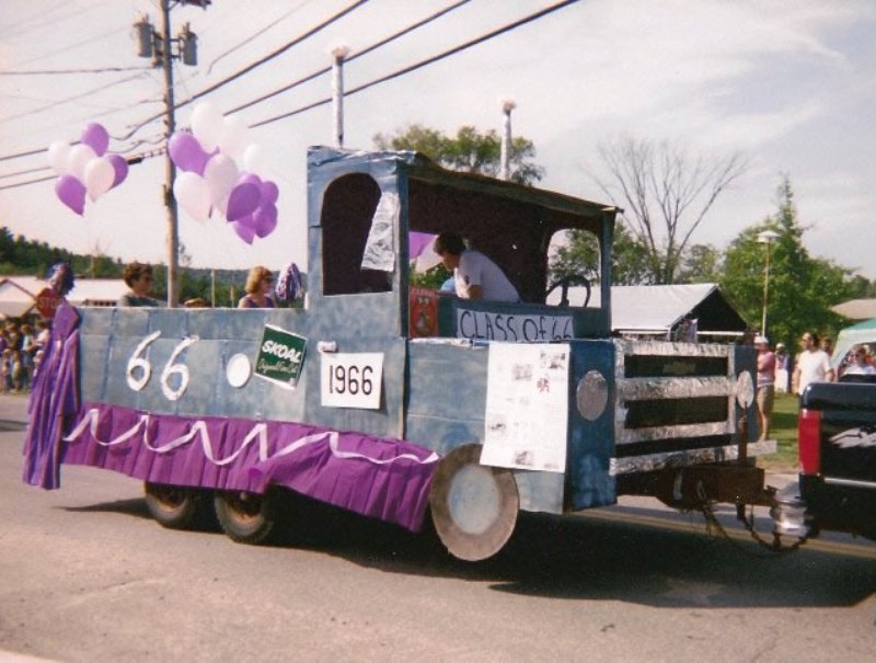 front of alumni float that looks like a truck