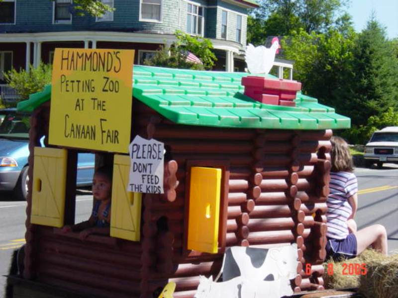 small cabin as a petting zoo float