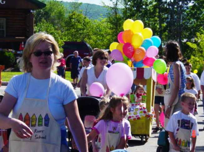 Indian River Nursery School teachers adn children marching in parade