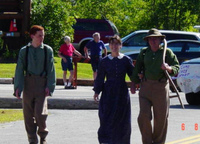 Adults and teen dressed in colonial clothes