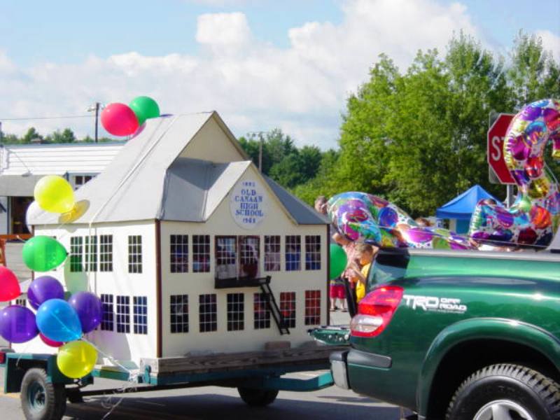 model of original Canaan High School on parade float