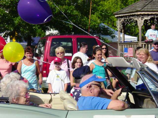 alumni riding in car