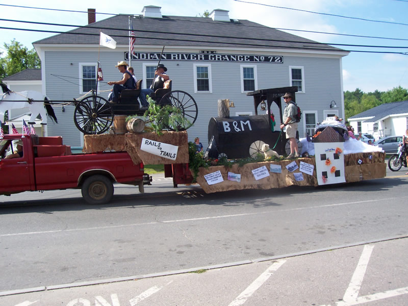 parade float of horse drawn buggy and train