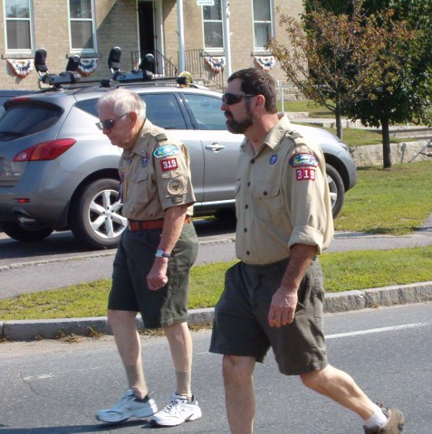 boy scout leaders marching in parade
