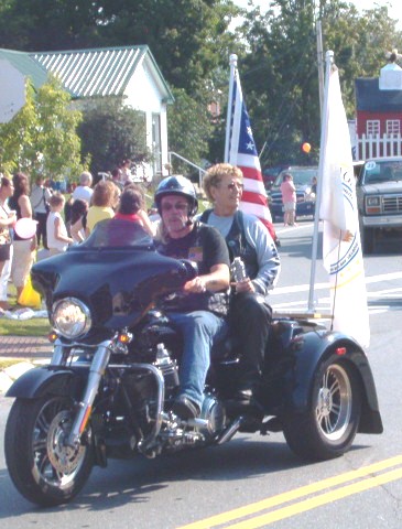 3 wheel motorcylce decked out in flags