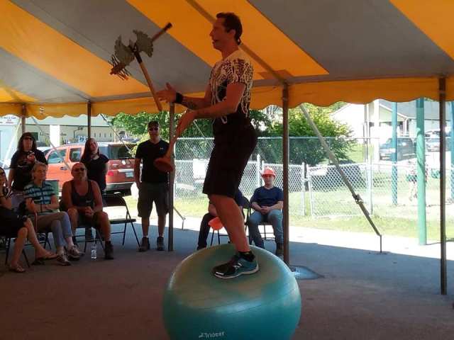 man on ball balancing axes